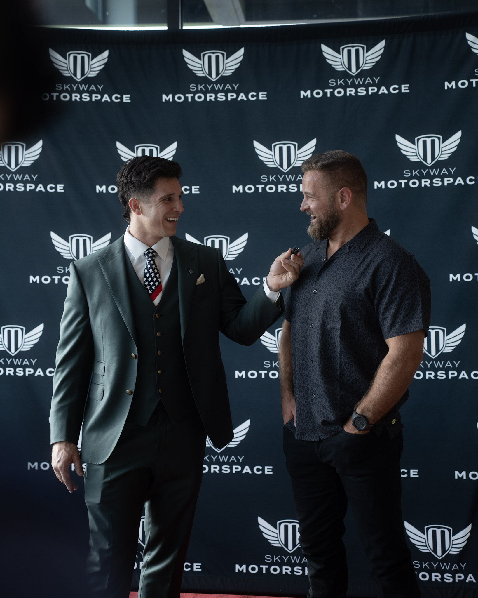 Two guests chatting at Skyway Motorspace during Nine and Dine